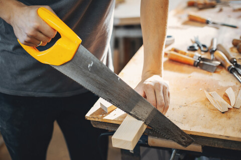 Carpenter works with tree